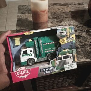 Green and White Recycling Truck